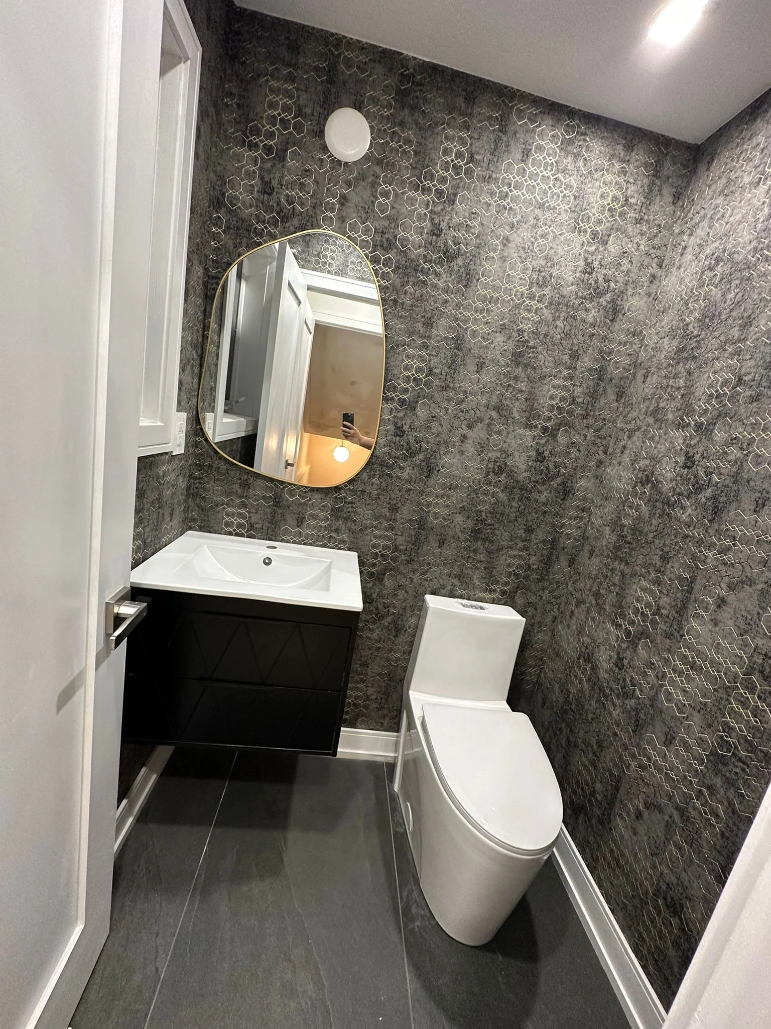 Powder room with patterned walls