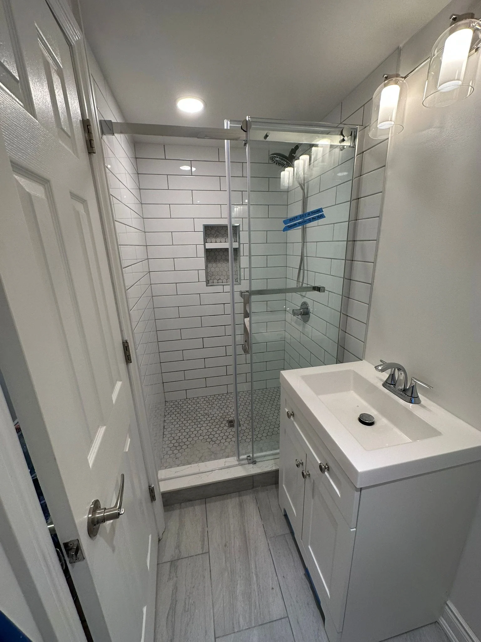 Bathroom vanity and glass shower