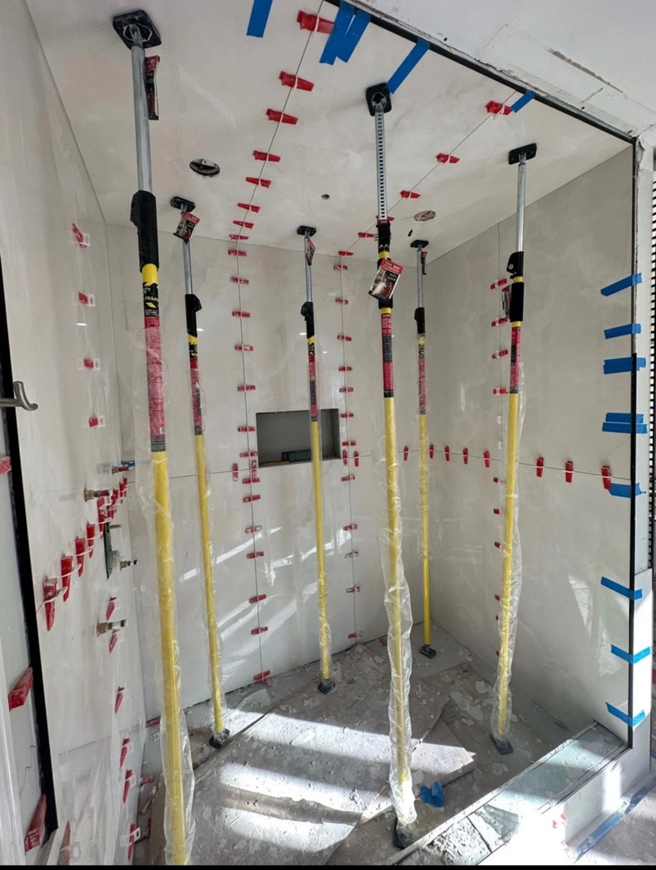Shower tile installation in progress