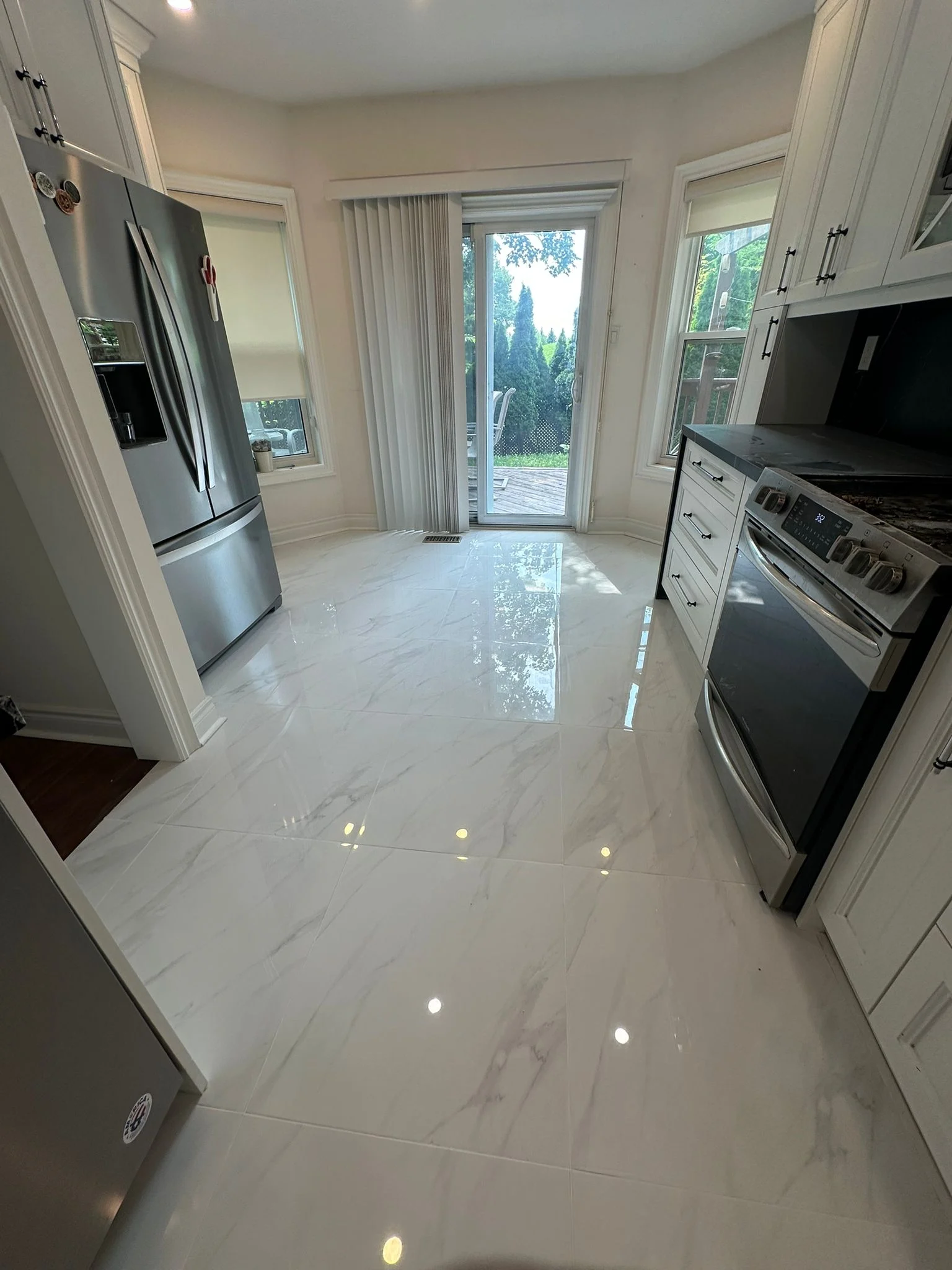 Galley kitchen with tiled floor