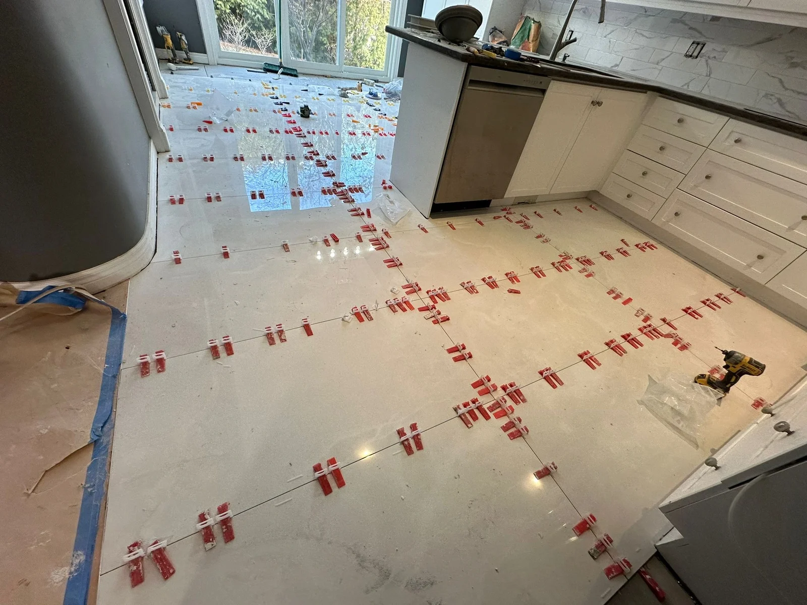 Kitchen floor tiling in progress